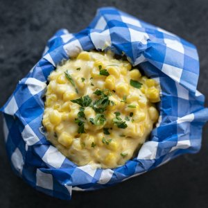 Creamy corn with cheese and parsley